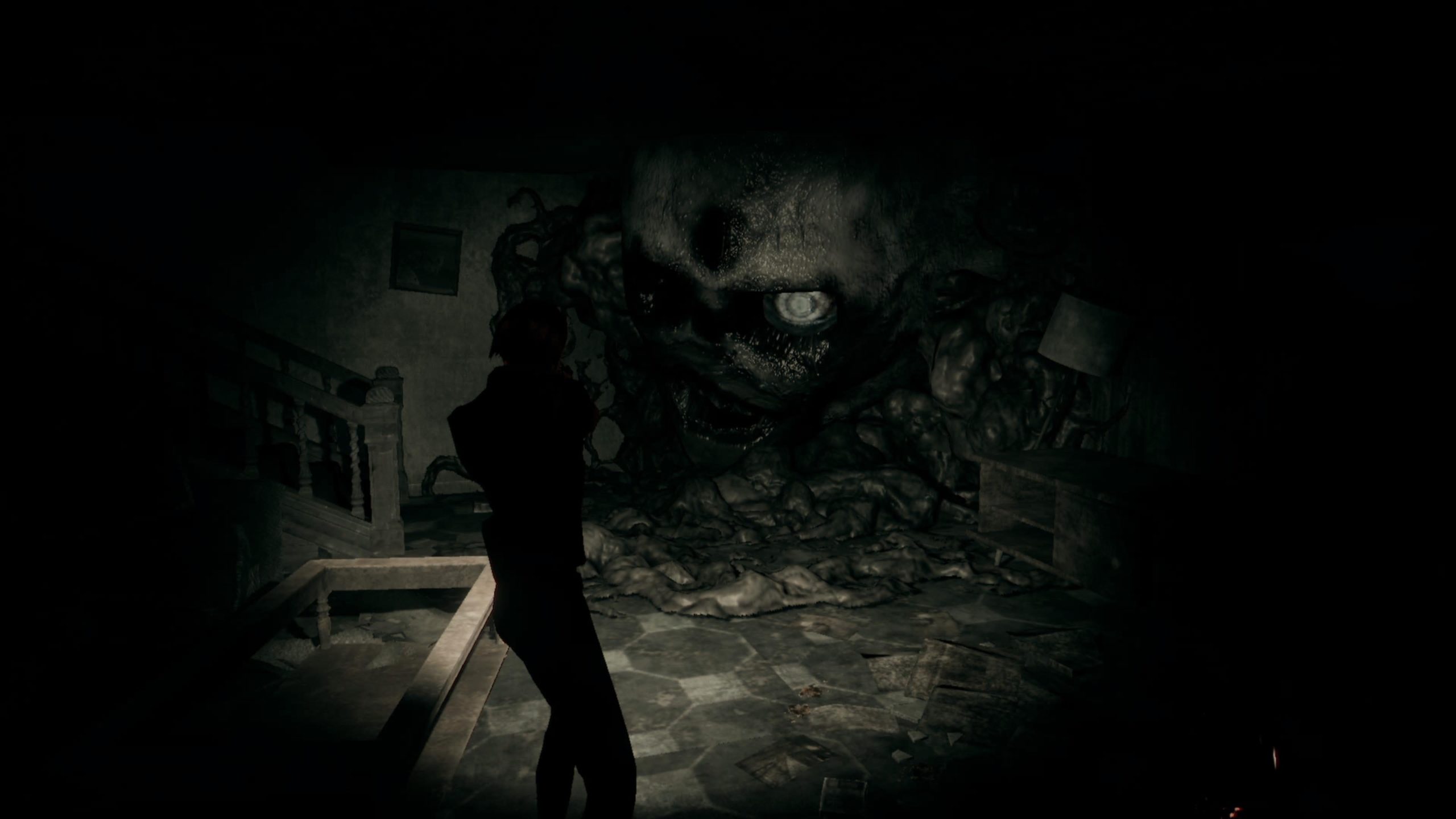 Screenshot of Hollowbody. Mica aims at a huge face made of black biomass.